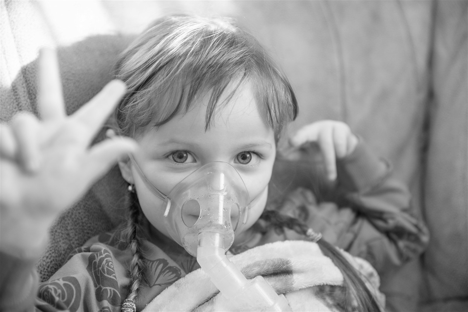 child/teen using therapy vest and nebulizer
